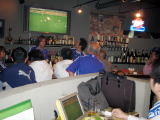 A bar with a homey atmosphere where a wide range of customers gather.
