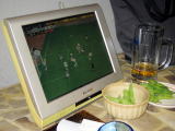 A bar with a homey atmosphere where a wide range of customers gather.
