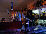 A hideaway bar in an alley. The yellow dogatee is the landmark.